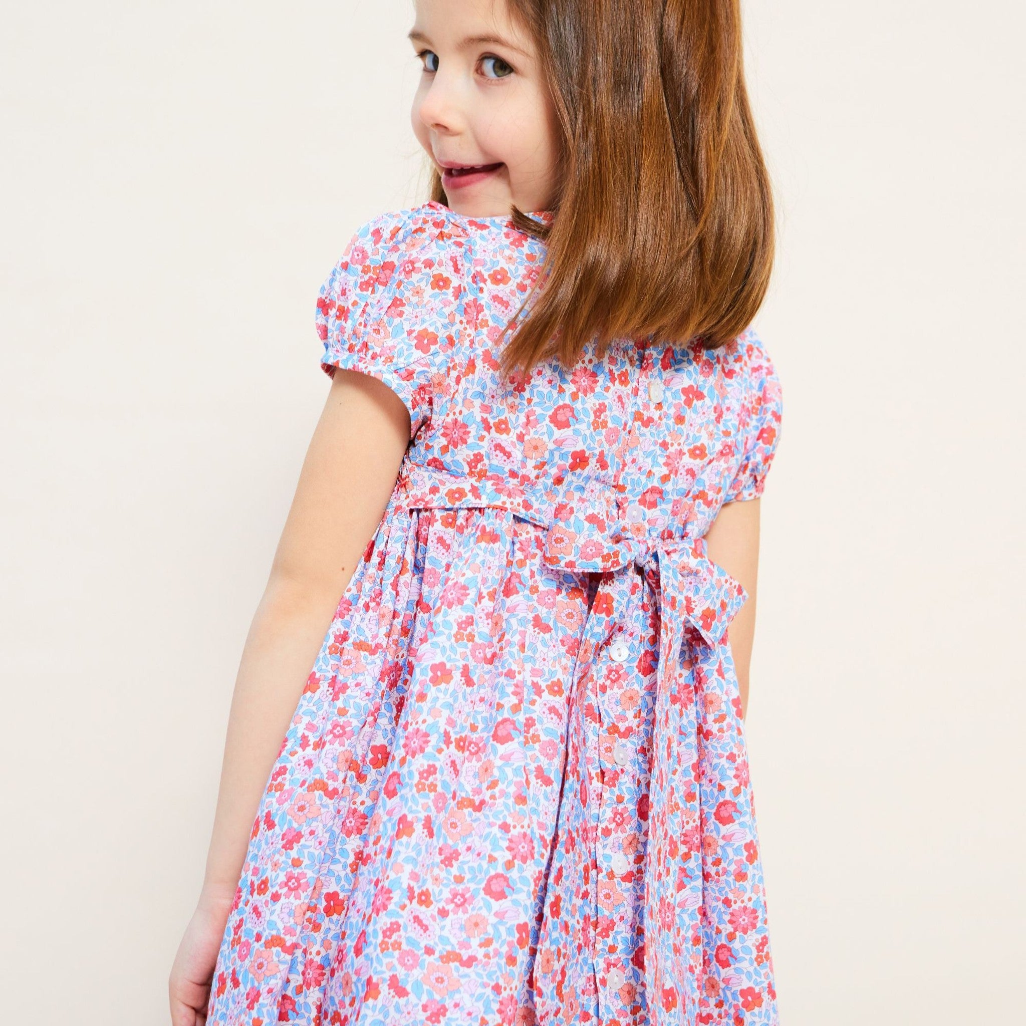 ANTOINETTE DRESS WITH CARNATION HAND SMOCKING MADE WITH LIBERTY THERESA PINK