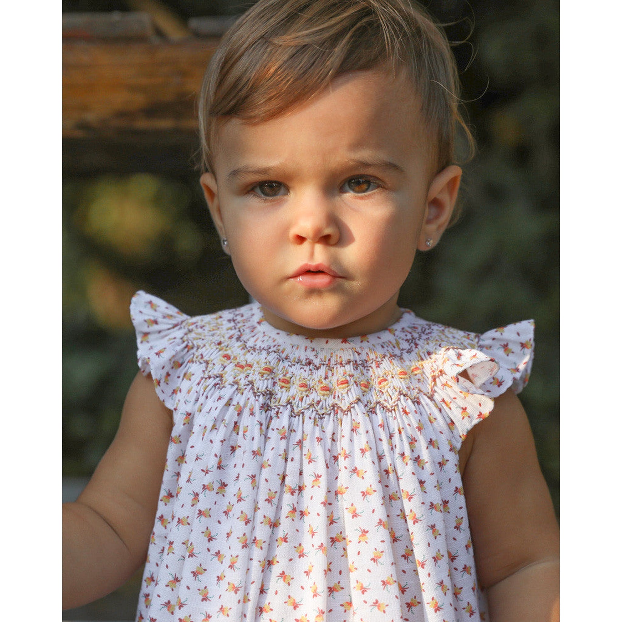 Hand Smocked Romper Flor Amarilla